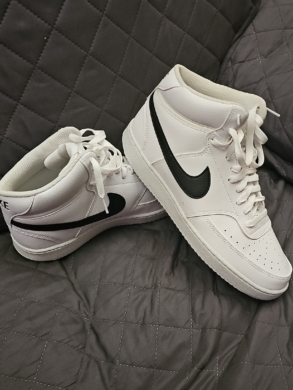 Nike Men’s White High-Top Sneakers with Black Swoosh Accent